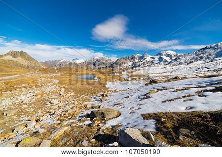 High Altitude Blue Alpine Lake In Autumn Season