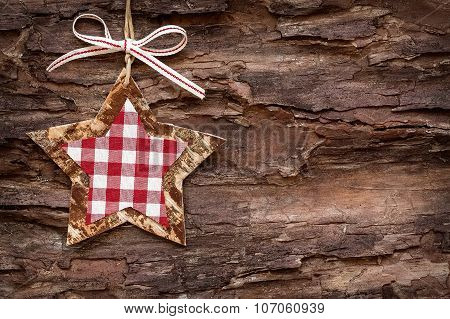christmas decoratons with baubles on wooden background