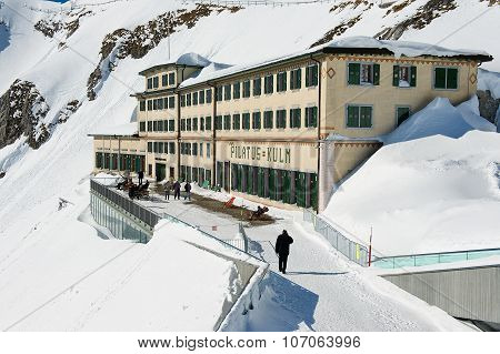 People walk by the terrace of the Pilatus-Kulm luxury hotel at the top of the Pilatus mountain.