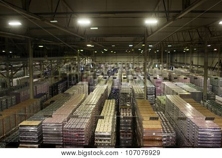 ST. PETERSBURG, RUSSIA - OCTOBER 24, 2015: Finished production warehouse at the Baltika - St Petersburg brewery during the October Beer Festival. The brewery is providing guided tours to the plant