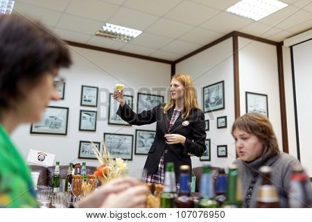 ST. PETERSBURG, RUSSIA - OCTOBER 24, 2015: Tourists during tasting session at the Baltika - St Petersburg brewery. This session is a part of the October Beer Festival celebrations