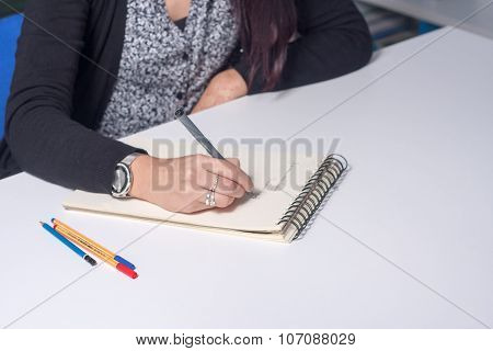 Young Female Student In Library