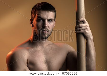 Muscular Man With Crossbar