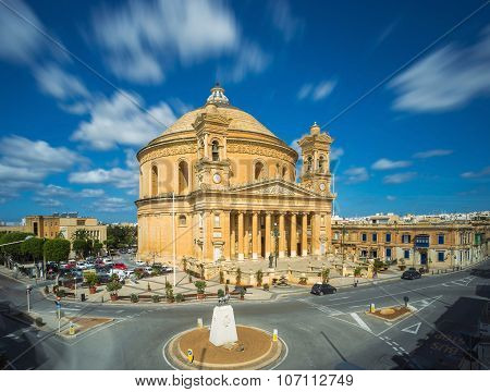 Long exposure shot about the famous Mosta Dome with moving clouds at daylight - Malta