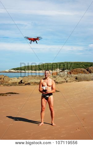 Man with controlled drone