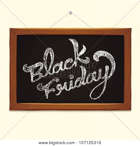 Black Friday calligraphy over blackboard