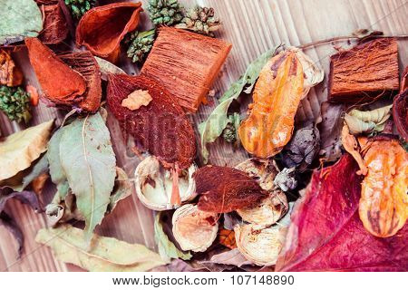 Autumn leaves and pot pourri on desk