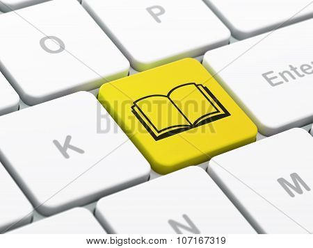 Science concept: Book on computer keyboard background