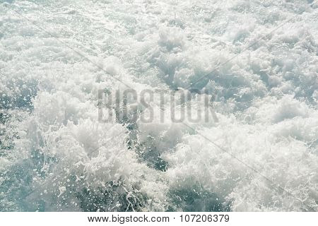 Turbulent Chaotic White Spray Of Sea Foam And Blue Sea Salt Water