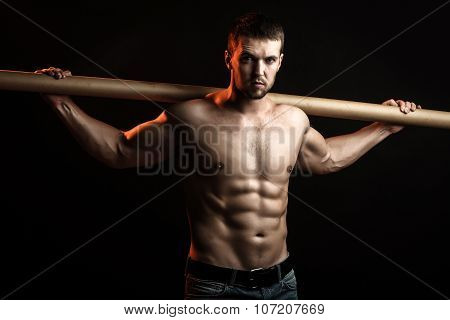 Muscular Man With Crossbar