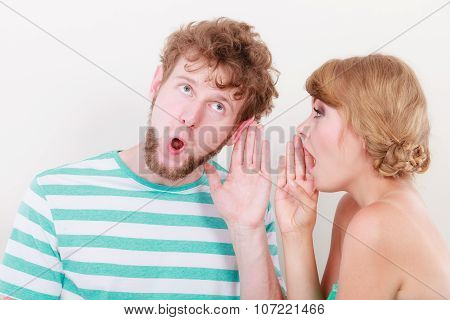 Woman Telling An Astonished Man Some Secrets