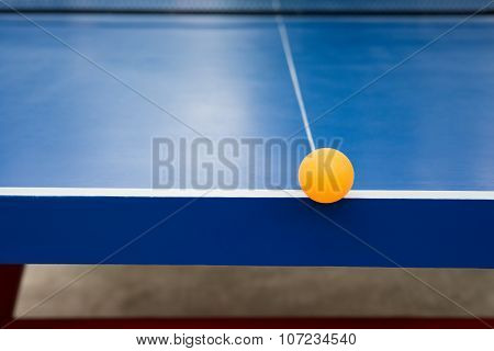 Pingpong Ball Hits The Edge Of A Blue Pingpong Table