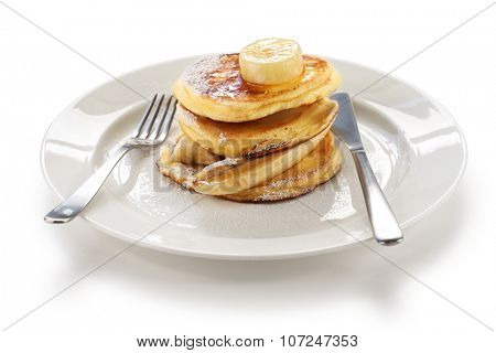 fluffy ricotta pancakes with banana isolated on white background
