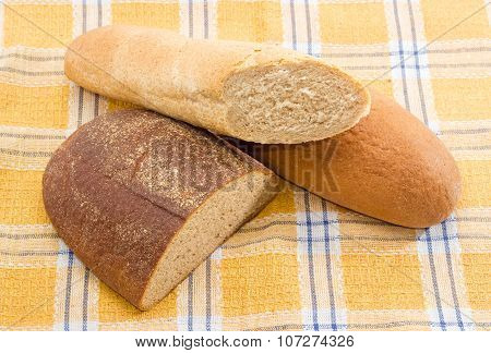 Different Types Of Bread On A Checkered Tablecloth