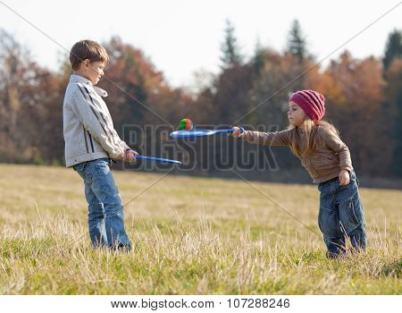 Kids Playing Tennis Outside