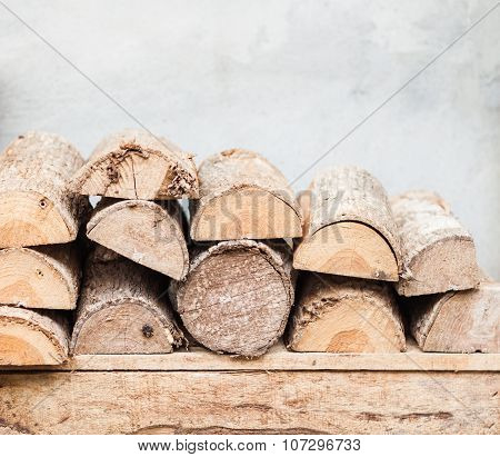 Stack Of Firewood Decorated In Garden