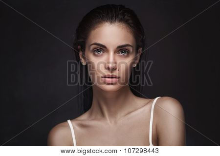 young adult woman with clean fresh skin and wet hair