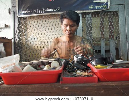 Tecnician Reparing Old Camera