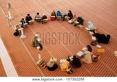 Group of people studying religion inside National Mosque of Malaysia