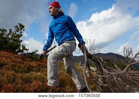 advanture man with backpack hiking on mountain forest