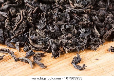 Black Tea Dry Leaves. Macro, Background