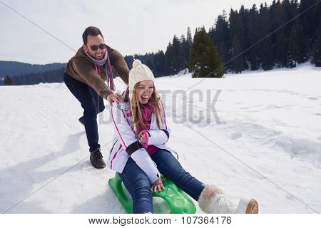romantic winter  scene, happy young couple having fun on fresh show on winter vacatio, mountain nature landscape