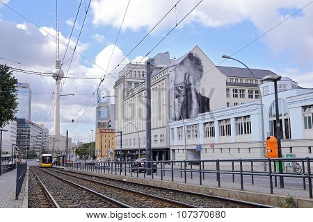 Yellow Tram At Berlin Alexanderplatz. In The Background You Can See The Tv Tower And The Station