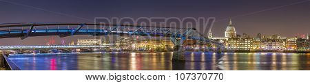 Panoramic shot of St Paul's Cathedral and the Millennium Bridge by night, London, UK