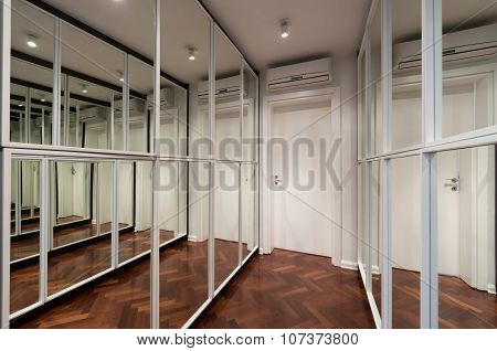 Modern Corridor Interior With Mirror Wardrobe Doors