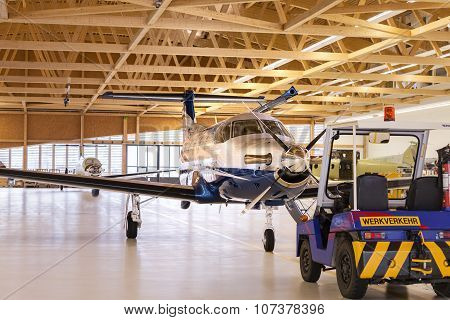 Stans, Switzerland - 29Th November 2010: Single Turboprop Aircraft Pilatus Pc-12 In Hangar.