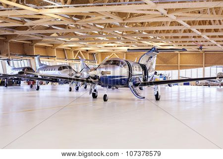 Stans, Switzerland, 29Th November 2010: Single Turboprop Aircraft Pilatus Pc-12 In Hangar.