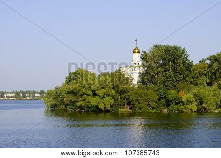 Church In The Trees On The Bank Of The River