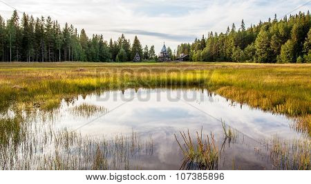 Panorama Of The Karelian Landscape Forest And The House On The Lake.