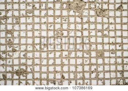 Wall Covered With An Old Square White Tiles