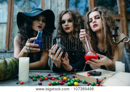 three witches at the table