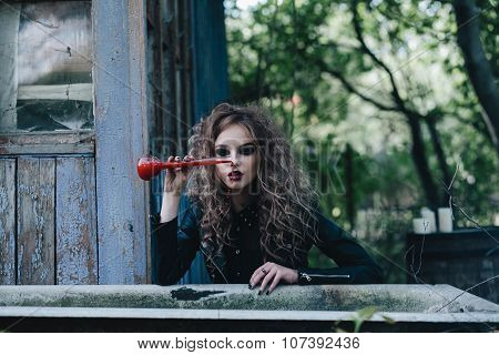 Vintage witch with elixir in hand