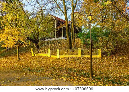 Country Home On Hillock In Autumn