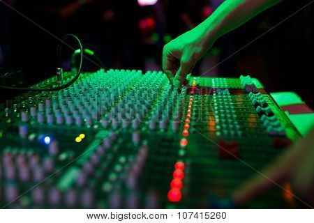 Hand Of Soundman On The Console