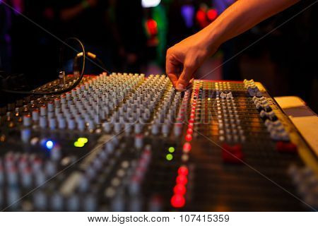 Hand Of Soundman On The Console