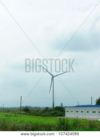 Wind-driven Generator In The Middle Of A Field