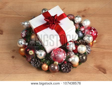 New Year gift on a golden tinsel background boly