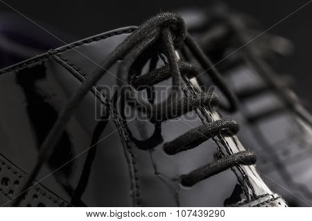 Footwear Concept. Horizontal Image. Pair Of Black Female Classic Leather Shoes On The Black Backgrou