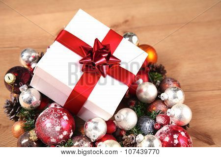 New Year gift on a golden tinsel background boly