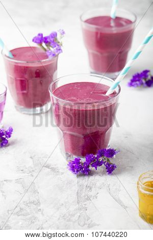 Blueberry, blackberry, honeysuckle, honeyberry smoothie with violet syrup and acai.