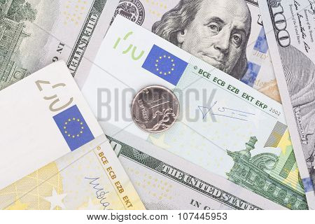 Ruble Coin Lying On Top Of Banknotes