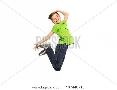 happiness, childhood, freedom, movement and people concept - smiling boy jumping in air