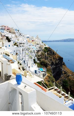 Fira, Greece - May 17: The View On Fira Town And Tourists Enjoying Their Vacation On May 17, 2014 In
