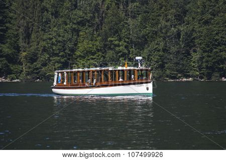 KOENIGSSEE, GERMANY - AUGUST 13, 2015: Electric pleasure boat operating on the Koenigssee lake and commute between Schoenau St. Bartholomew and Salet