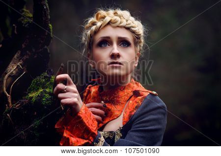 Frightened Beautiful Girl in the night of the forest. Farytale