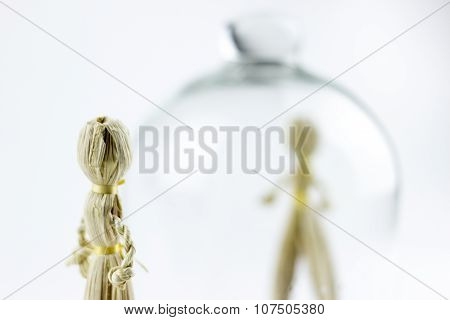 Man And Woman Straw Dolls, Separated By A Glass Bell